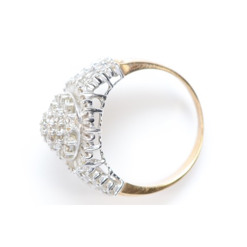 460 - A 9ct gold brilliant and baguette cut diamond cluster ring, diamond set shoulders, P 1/2, 5.6gm