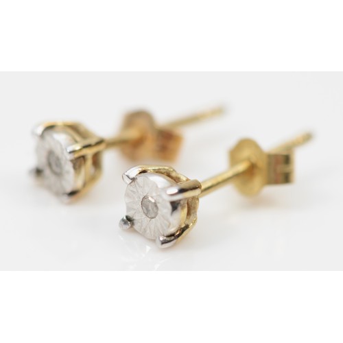 466 - A 9ct gold pair of illusion set diamond ear studs, 0.5gm