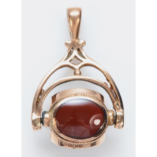 467 - A 9ct rose gold triplet swivel seal, black opal doublet, carnelian and onyx, 26mm, 3.9gm