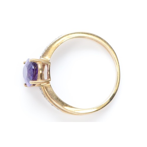 470 - A 9ct gold amethyst single stone ring, of good colour, 9 x 7mm, diamond set shoulders, P, 2.5gm