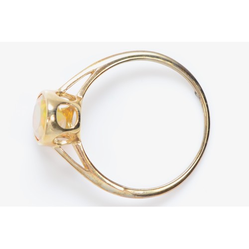 477 - A 9ct gold and facetted water opal single stone ring, R, 2gm