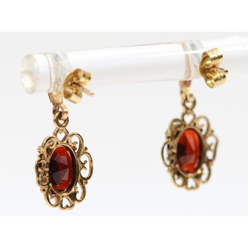 497 - A 9ct gold pair of garnet ear rings, 1.3gm