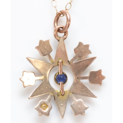 501 - A late Victorian 9ct rose gold, blue paste and seed pearl six ray star pendant, stamped 9, 18mm, cha... 