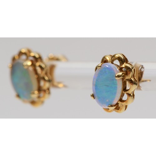 504 - A 9ct gold pair of opal ear studs, stone 8 x 6mm, 1.8gm