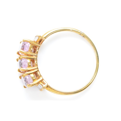 505 - A 9ct gold three stone kunzite ring, with baguette cut diamond shoulders, S, 3.4gm