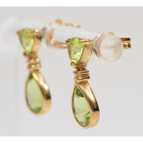 506 - A 9ct gold pair of peridot drop ear pendants, 17mm, 2.2gm