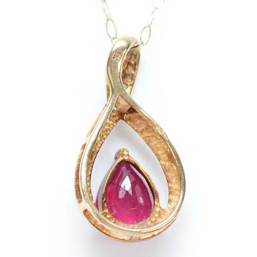 507 - A 9ct gold red stone and diamond pendant, 22mm, chain, 2gm