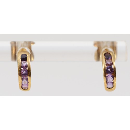 524 - A 9ct gold pair of amethyst ear studs, 0.8gm