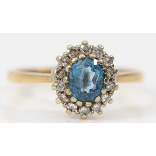 526 - A 9ct gold blue topaz and diamond cluster ring, N 1/2, 2.5gm