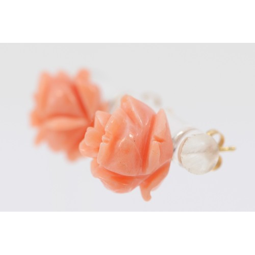 527 - A pair of 14K gold mounted carved coral rose ear studs, diameter 10mm