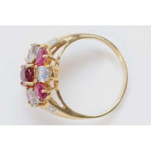 534 - A 9ct gold ruby and aquamarine cluster ring, with brilliant cut diamond set shoulders, Q, 4.7gm