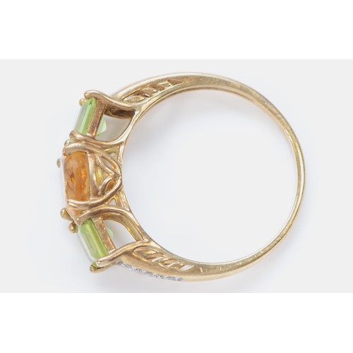 535 - A 9ct gold citrine and peridot three stone ring, diamond set shoulders, R, 3.3gm