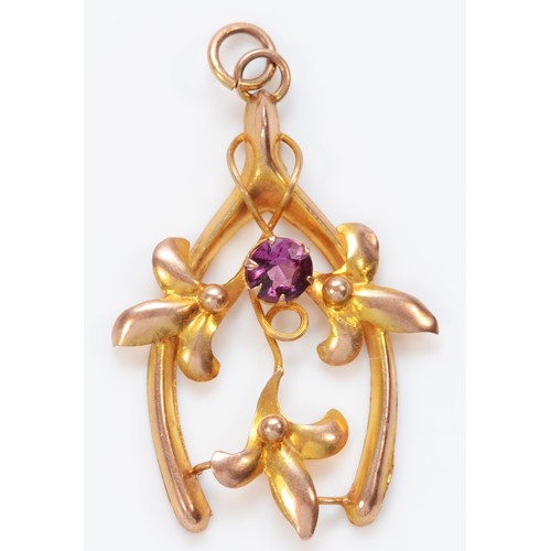 538 - An Edwardian 9ct rose gold floral wishbone pendant, set with an amethyst, by A.J.C. stamped 9ct, 29m... 