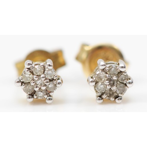 545 - A 9ct gold pair of diamond cluster ear studs, 0.9gm