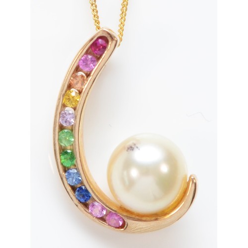 560 - A 9ct gold multi colour ruby and sapphire and 6mm cultured pearl pendant, chain, 2gm