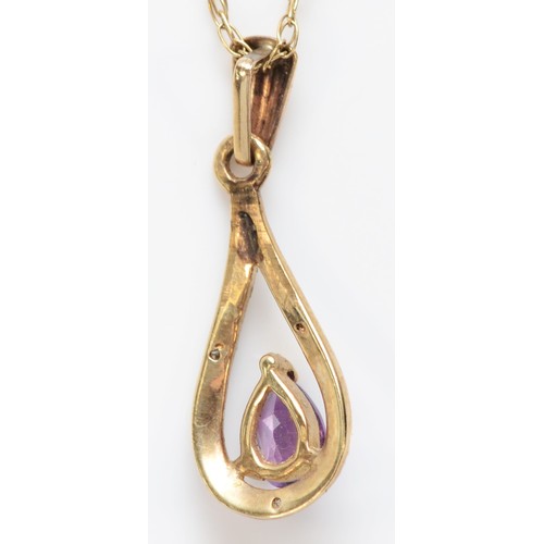 561 - A 9ct gold amethyst and diamond pendant, chain, 1.7gm