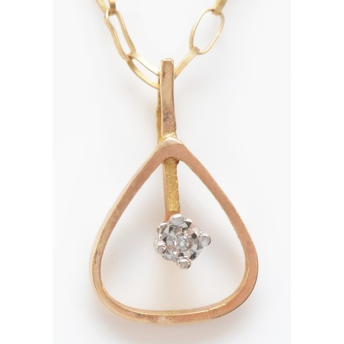 562 - A 9ct gold and diamond pendant, 1.2gm