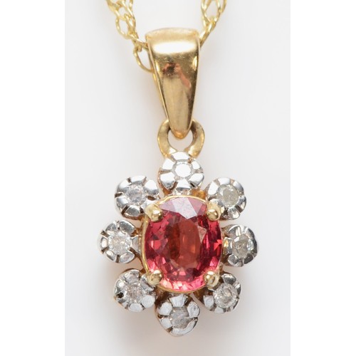 564 - A 9ct gold red gemstone and diamond pendant, chain, 1.8gm