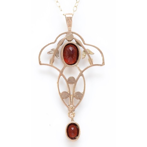 568 - A 9ct gold Edwardian style garnet and half pearl pendant, 38mm overall, 2.3gm