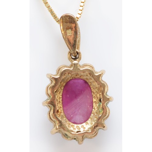 570 - A 9ct gold and enhanced ruby and white stone cluster pendant, 21mm overall, chain, 3.8gm