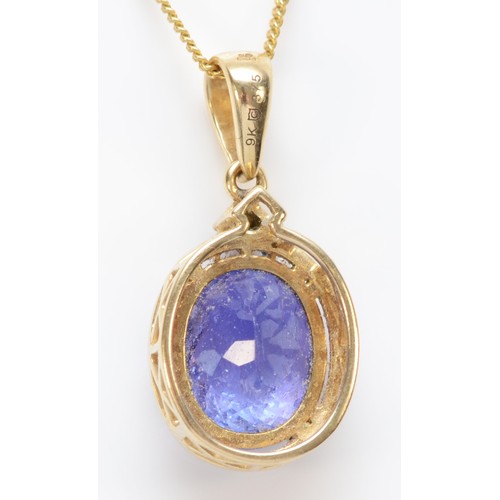 571 - A 9ct gold and tanzanite pendant, stone 12 x 10mm, chain, 3.8gm