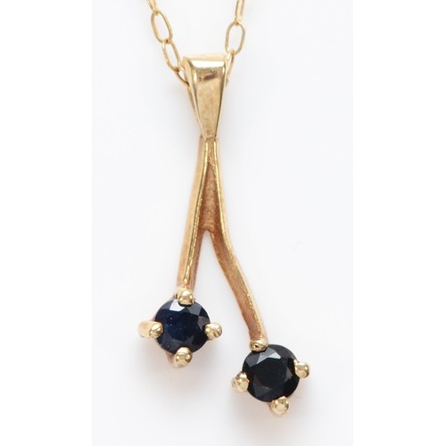 572 - A 9ct gold and sapphire pendant, chain, 1gm