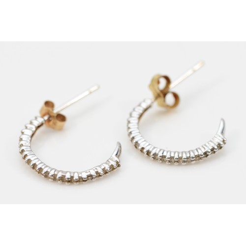 577 - A pair of 9ct white gold and diamond ear hoops, 15mm, 0.8gm