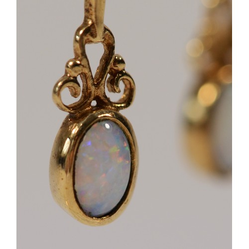 578 - A 9ct gold pair of opal drop ear pendants, 24mm, 1.5gm