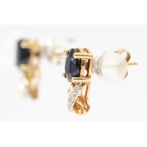 583 - A 9ct gold pair of sapphire and diamond ear studs, 1.4gm