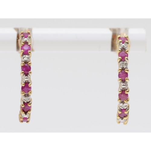 584 - A 9ct gold pair of ruby and diamond ear hoops, 19mm, 1.7gm