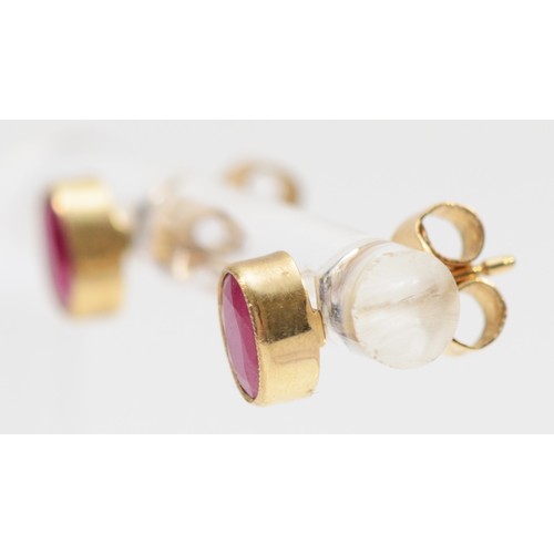 590 - A 9ct gold pair of 6mm ruby ear studs, 0.9gm