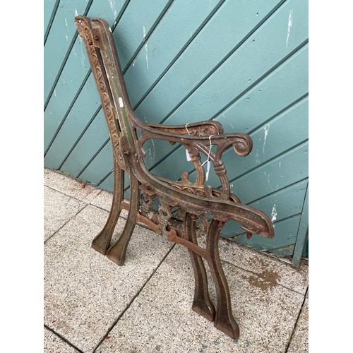 28 - A pair of cast iron garden bench ends.