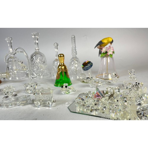 A collection of Swarovski crystal animal and figural glass sculptures ...