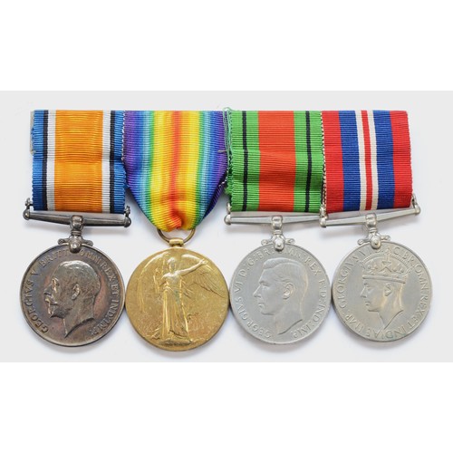 565 - WWI _ WWII mounted group of four medals, War and Victory, named 130428 Dvr. F. Kirby. R.A. and WWII ... 