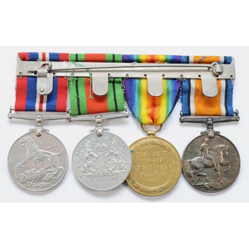 565 - WWI _ WWII mounted group of four medals, War and Victory, named 130428 Dvr. F. Kirby. R.A. and WWII ... 