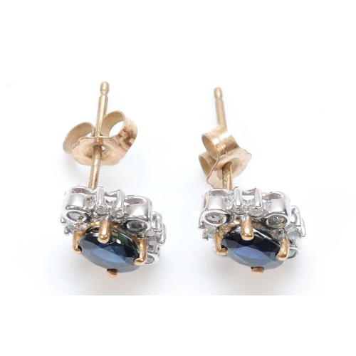 22 - A pair of 9ct gold oval cut sapphire and diamond cluster stud earrings with scroll backs, 10mm front... 