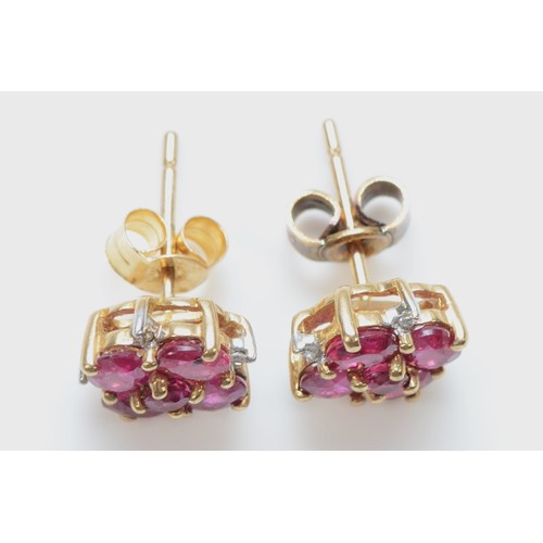 32 - A 9ct gold ruby and diamond cluster stud earrings with scroll backs, 8mm fronts, 2g