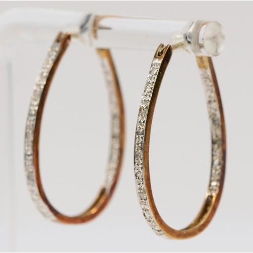 34 - A pair of 9ct gold bi-colour diamond hoop earrings, 25mm length, 3.3g