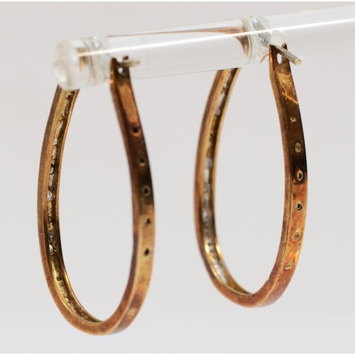 34 - A pair of 9ct gold bi-colour diamond hoop earrings, 25mm length, 3.3g