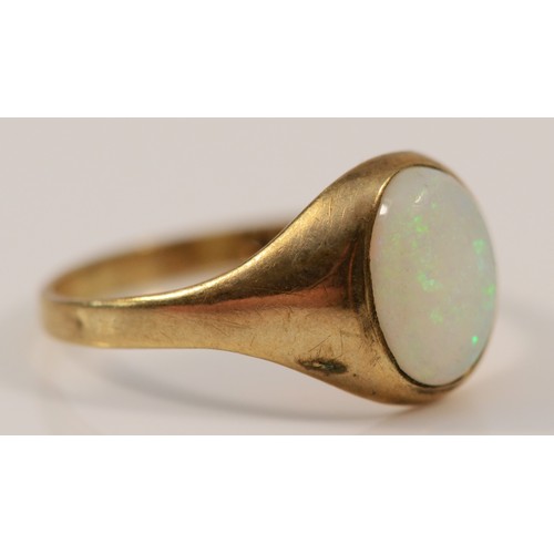 42 - A 9ct gold cabochon cut opal signet ring, bezel set, I, 1.3g