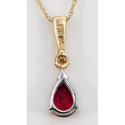 55 - A 9ct gold and pear shaped red gemstone pendant with necklace, pendant is 17mm in length, 1.1g