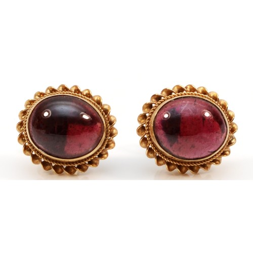 62 - A pair of 9ct gold cabochon garnet stud earrings, bezel set with scroll backs, 3.3g