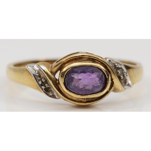 63 - A 9ct gold oval cut amethyst and diamond dress ring, L 1/2, 1.8g