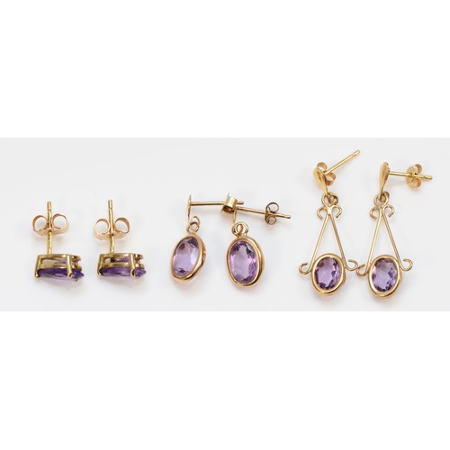 68 - Three pairs of 9ct gold amethyst earrings, largest have a 25mm drop, 2.7g