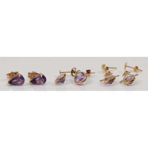 68 - Three pairs of 9ct gold amethyst earrings, largest have a 25mm drop, 2.7g