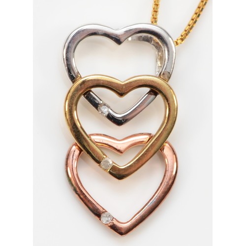 72 - A 9ct three colour gold diamond, interlocking heart pendant with chain, pendant measures 20mm, 2.1g