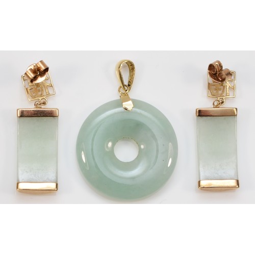 74 - A 9ct gold jade pendant with a pair of 9ct gold jade earrings, pendant is 20mm, earrings are 26mm, 7... 