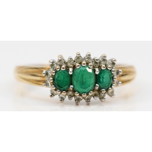 78 - A 9ct gold chrysoprase and diamond halo trilogy dress ring, Q 1/2, 2.9g