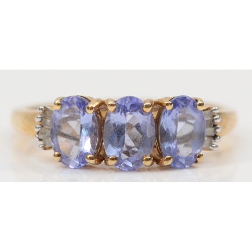 80 - A 9ct gold tanzanite and diamond trilogy dress ring, M, 2.2g