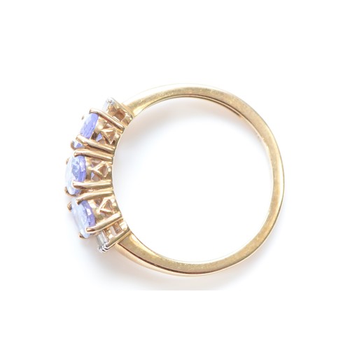 80 - A 9ct gold tanzanite and diamond trilogy dress ring, M, 2.2g